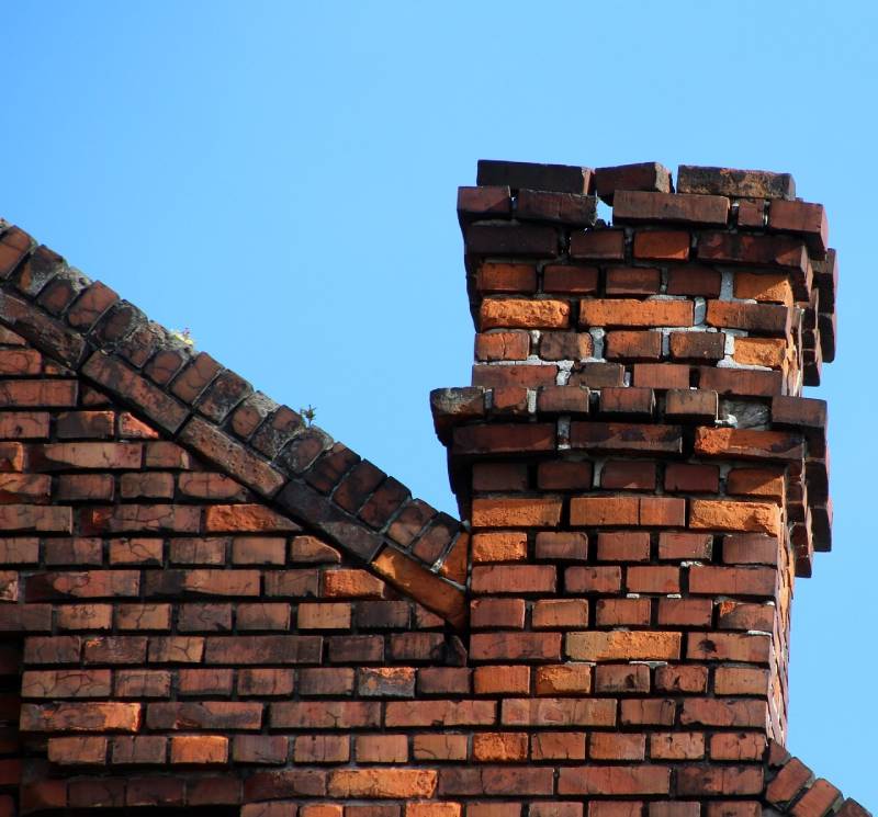 Signs Your Rancho Santa Fe Home Needs a Chimney Inspection Damaged chimney on an Rancho Santa Fe home showing cracks and missing mortar